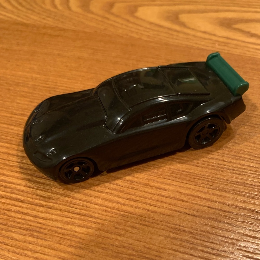 Hot Wheels black car with green fin